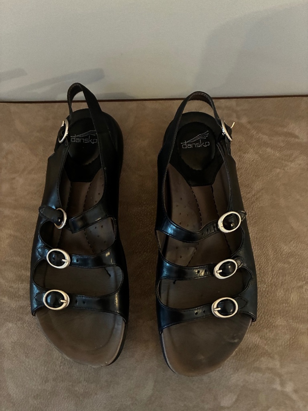 Excellent use condition black leather Danskthree strap sandals with a backstrap.
